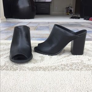 Heeled black mules